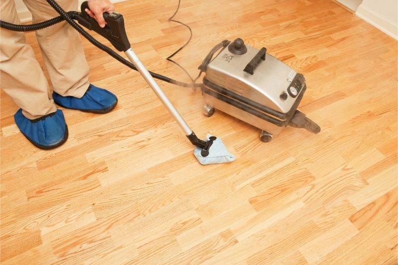 steam mopping hardwood floor