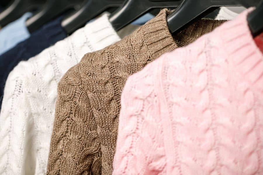hanging sweaters in closet